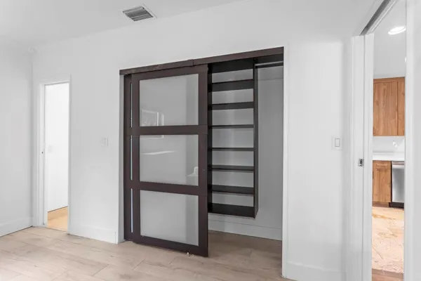 a bathroom with 2 sink and a mirror