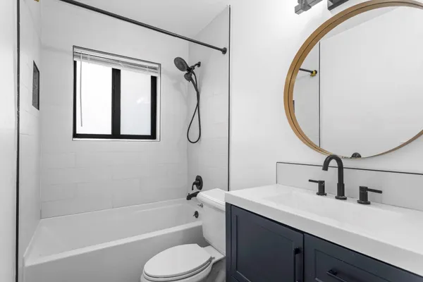 a view of a room with wooden floor and window
