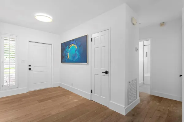 a bathroom with a sink shower and a mirror