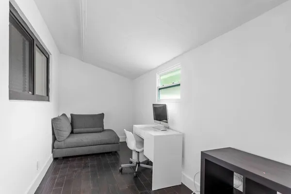 a view of a house with a yard and plants