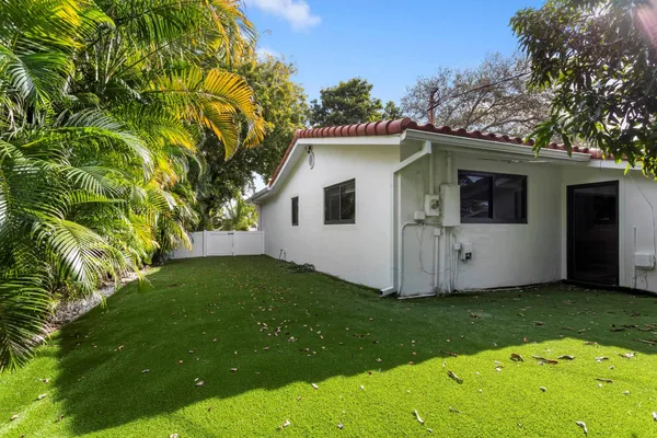 a view of a house with a yard porch and sitting area