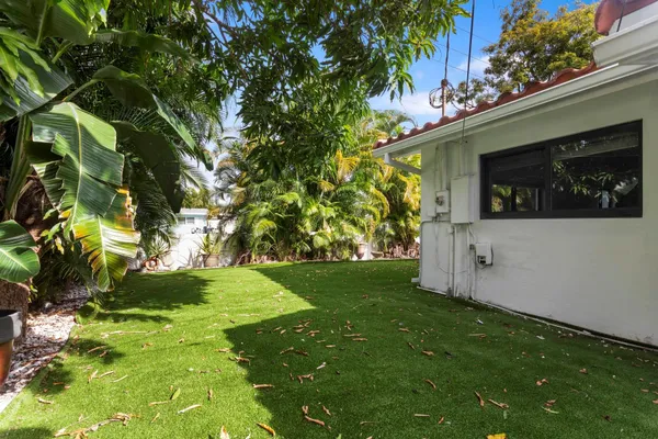 a view of a backyard with sitting area