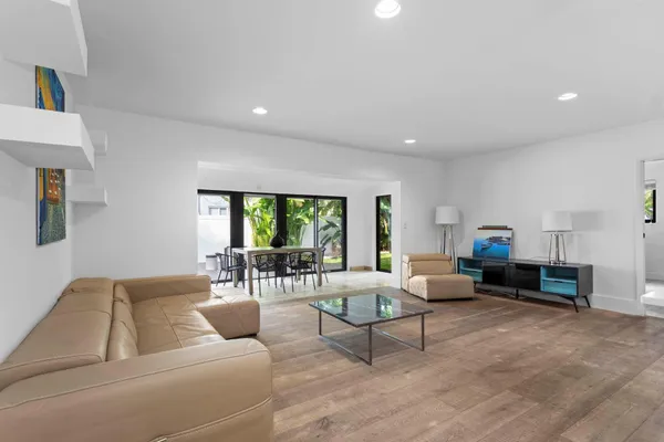 a living room with furniture and a large window