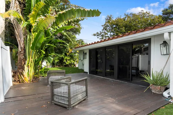 a view of a backyard with a sitting area