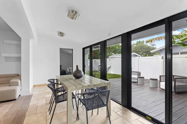 a view of a dining room with furniture window and outside view
