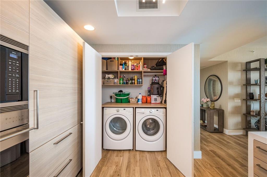 17111 Biscayne Boulevard North Miami Beach, FL 33160 - Photo 25 of 37 a storage and utility room with washer and dryer