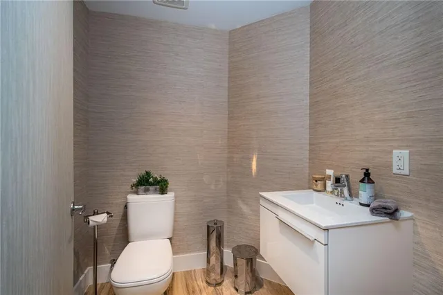 a bathroom with a tub a sink and mirror