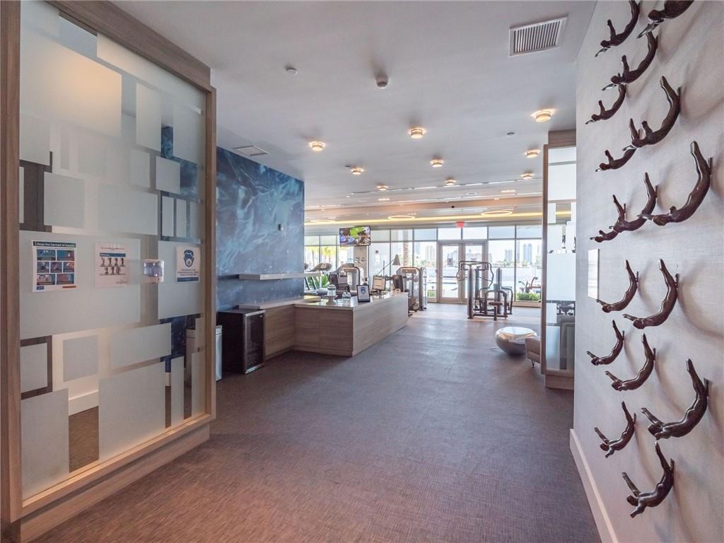 17111 Biscayne Boulevard North Miami Beach, FL 33160 - Photo 9 of 37 a lobby with furniture and a floor to ceiling window