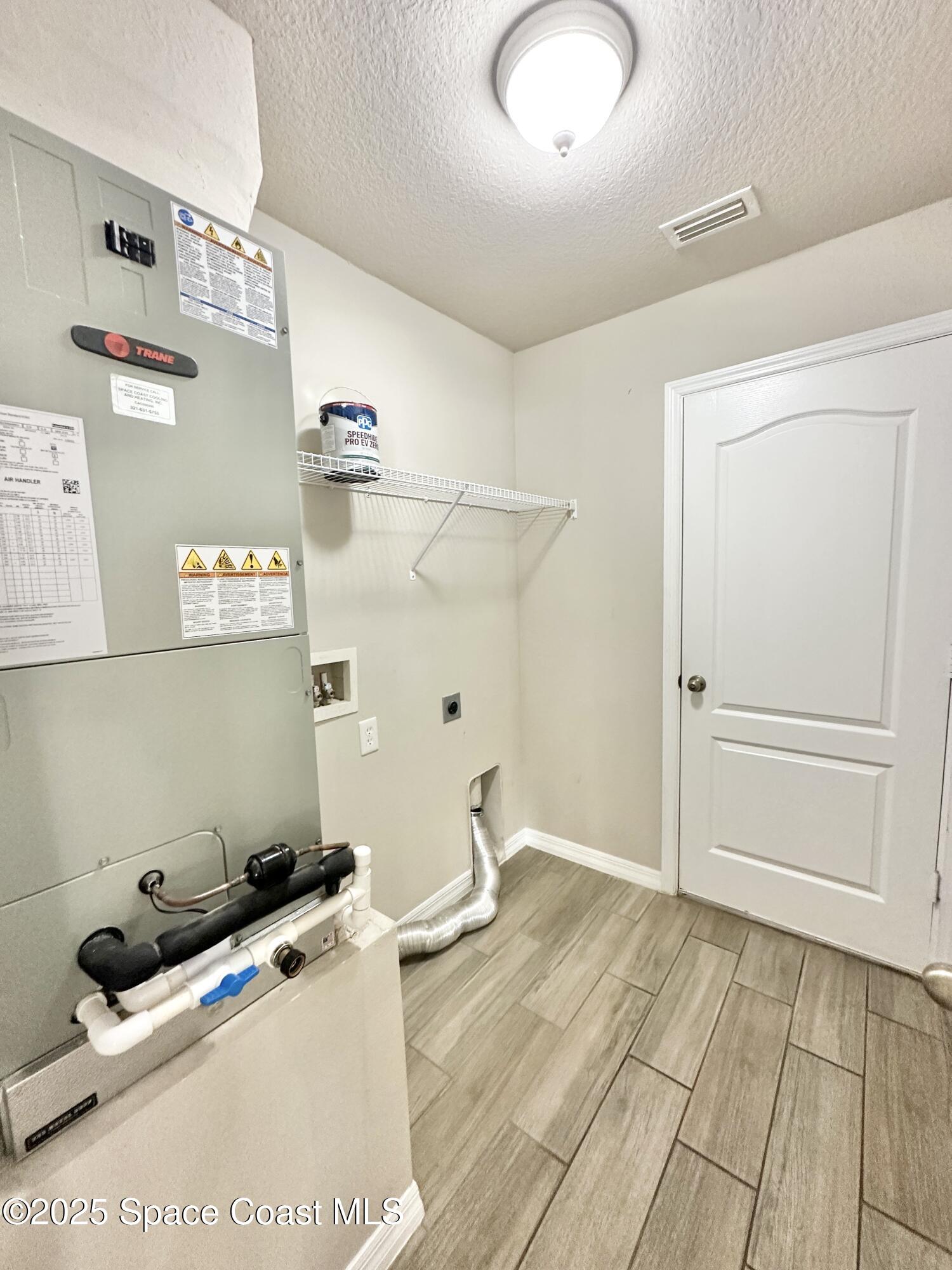 449 Alison Street Titusville, FL 32780 - Photo 19 of 22 a room with storage and utility