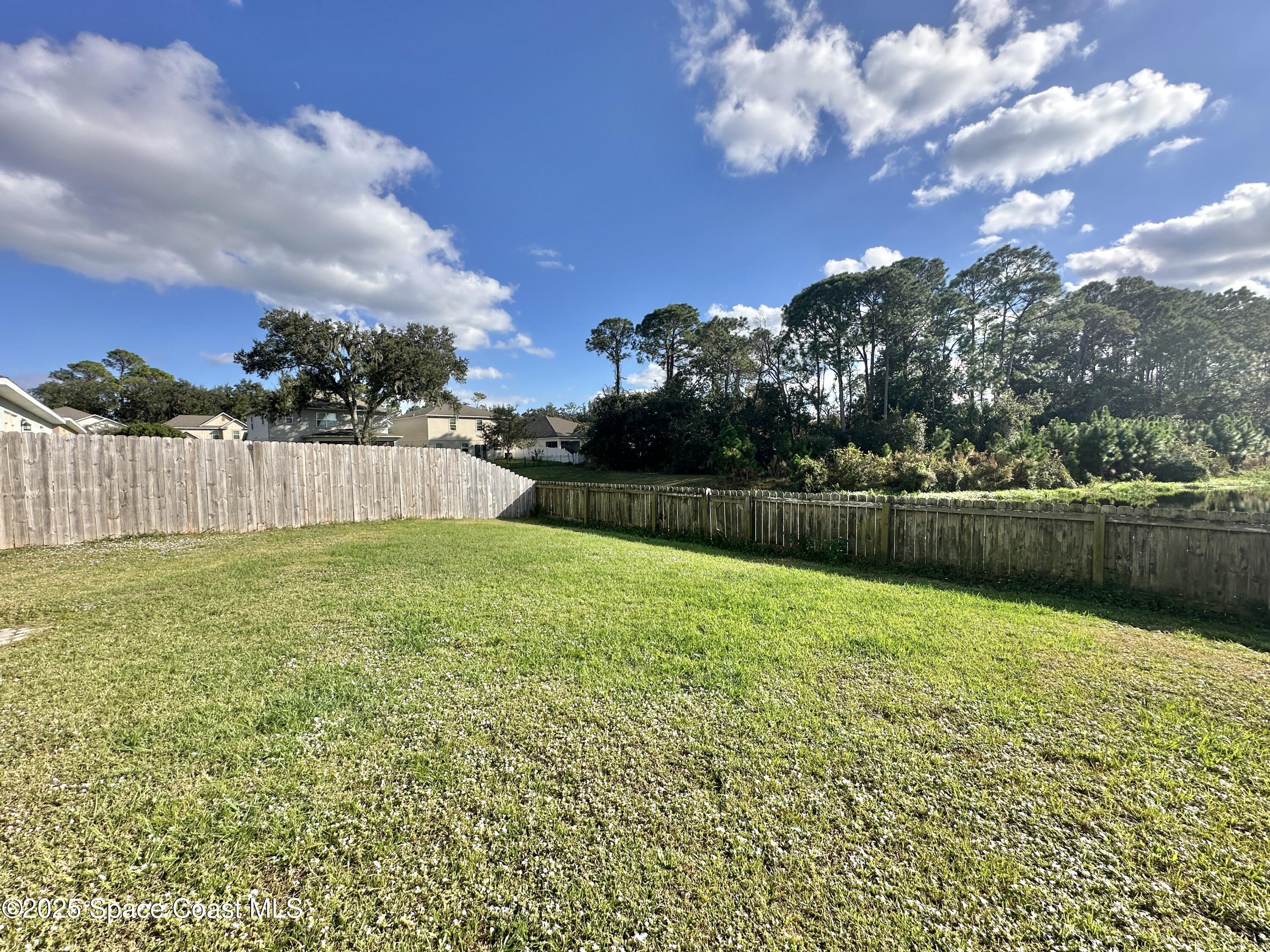 449 Alison Street Titusville, FL 32780 - Photo 21 of 22 a view of a backyard