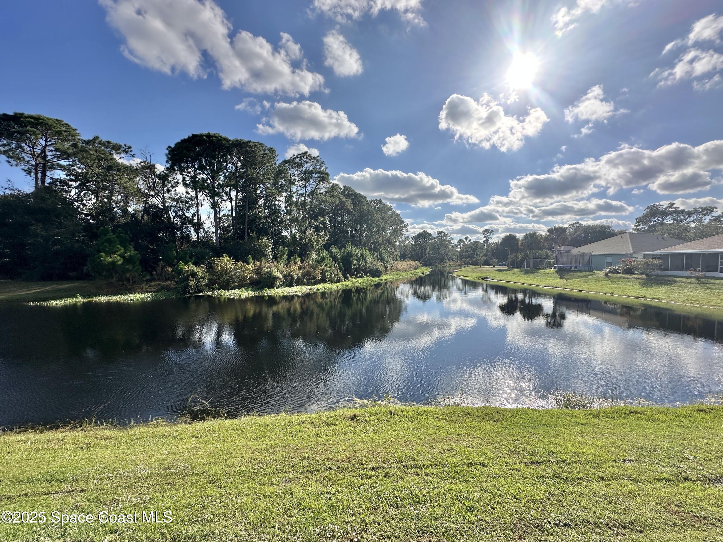 449 Alison Street Titusville, FL 32780 - Photo 22 of 22 a view of a lake with a city