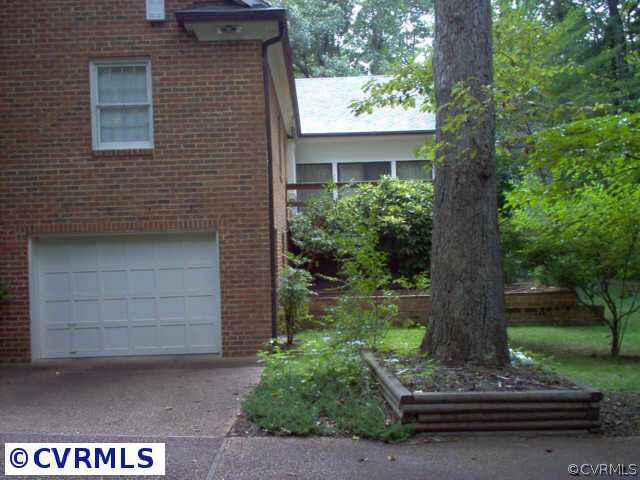 9201 Cardiff Road Richmond, VA 23236 - Photo 3 of 8 a front view of a house with a garden