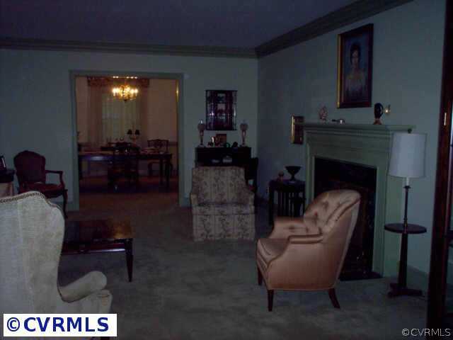 9201 Cardiff Road Richmond, VA 23236 - Photo 6 of 8 a living room with furniture and a fireplace