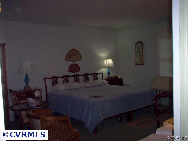 9201 Cardiff Road Richmond, VA 23236 - Photo 8 of 8 a bed sitting in a bedroom next to a window