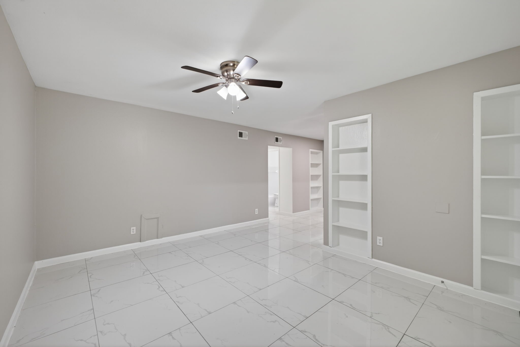 10600 South Post Oak Road, Unit 101 Houston, TX 77035 - Photo 7 of 32 Build in bookshelves