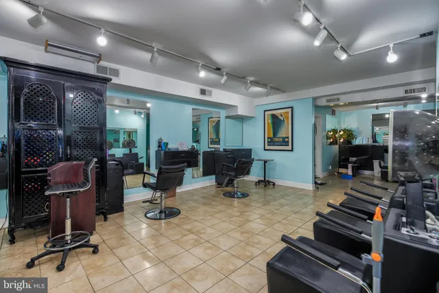 a living room with lots of furniture and gym equipment