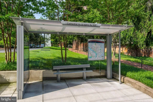 a view of a patio with a table chairs and a backyard
