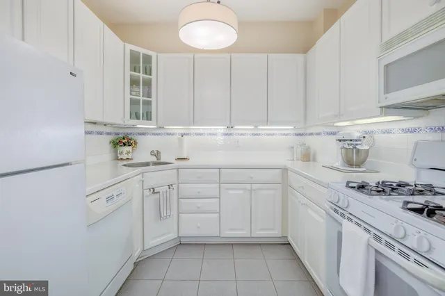 a kitchen with cabinets and appliances