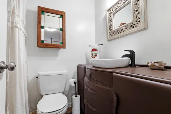 an aerial view of a house with garden space and street view