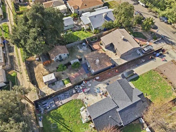 an aerial view of residential houses with outdoor space
