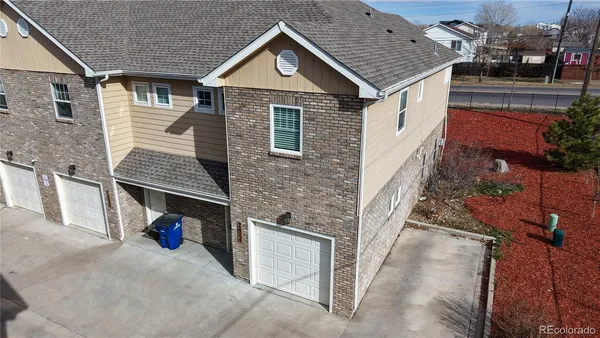 a view of a house with a yard and garage