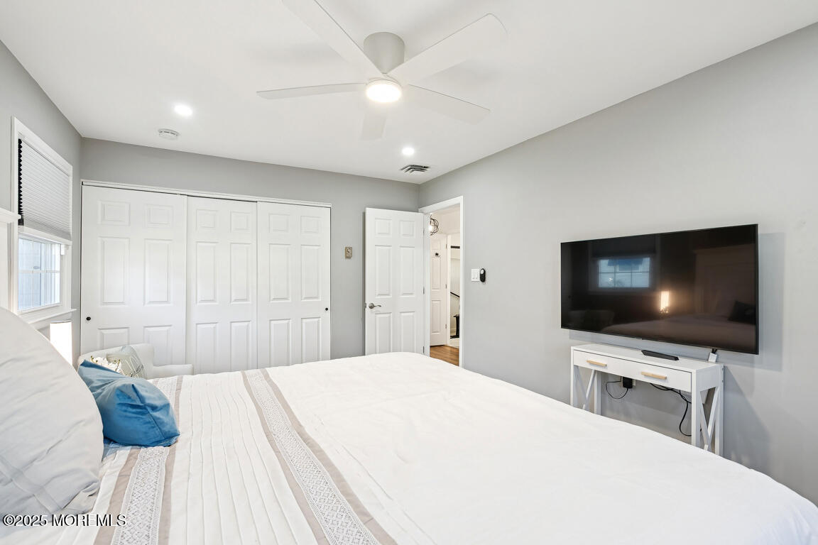 5 Phillips Road Brick, NJ 08724 - Photo 10 of 31 a bedroom with a bed and a flat screen tv