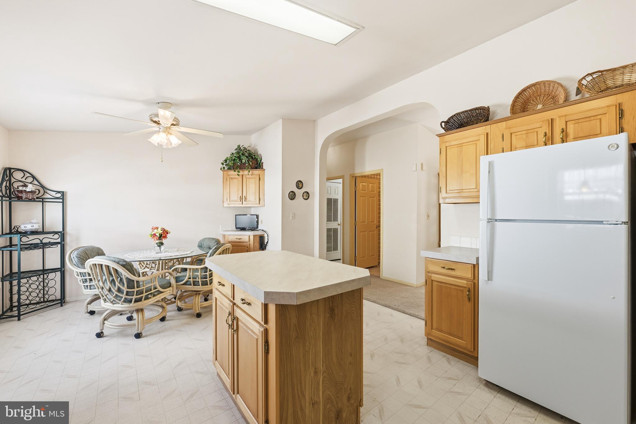 524 Butternut Court New Hope, PA 18938 - Photo 14 of 26 a living room with a dining table chairs and a refrigerator