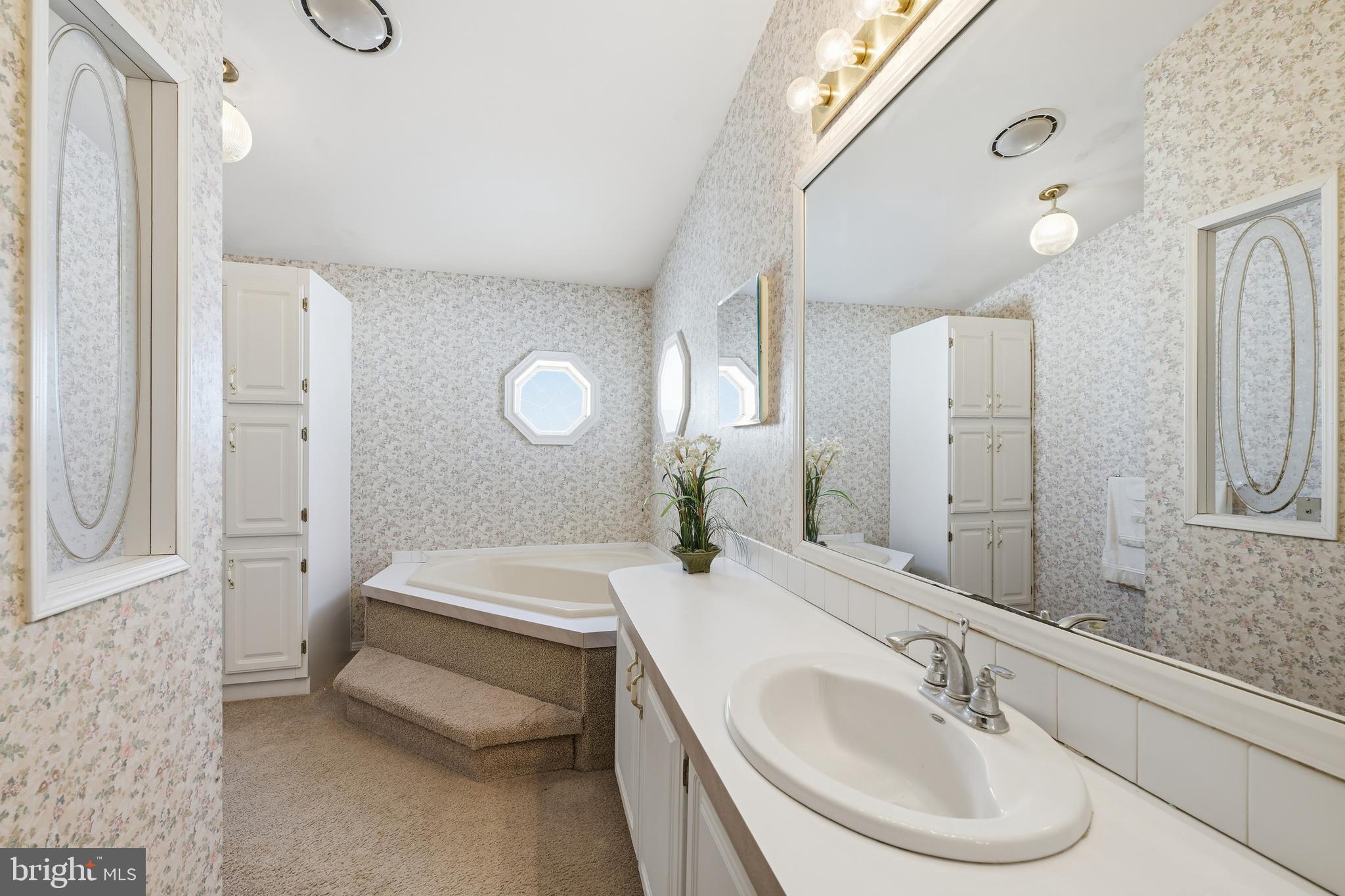 524 Butternut Court New Hope, PA 18938 - Photo 22 of 26 a bathroom with a tub sink and mirror