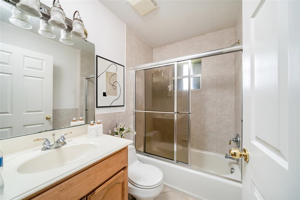 7205 Hibiscus Road Fort Pierce, FL 34951 - Photo 11 of 18 a bathroom with a sink toilet and shower