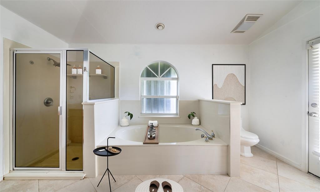 7205 Hibiscus Road Fort Pierce, FL 34951 - Photo 13 of 18 a bathroom with a tub sink and mirror