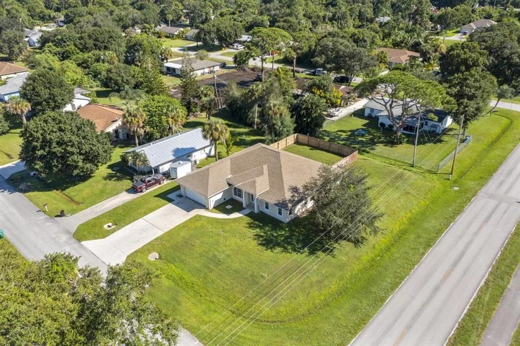 7205 Hibiscus Road Fort Pierce, FL 34951 - Photo 2 of 18 an aerial view of residential houses with outdoor space