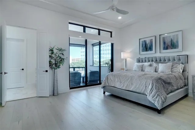 a spacious bathroom with a tub sink and mirror