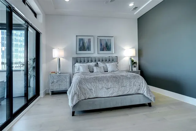 a spacious bathroom with a tub sink and mirror