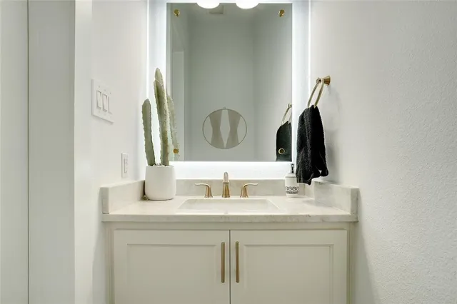 a bathroom with a sink a toilet and bathtub