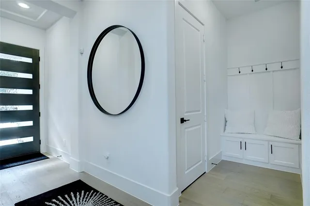 a view of a chair and tables in the porch