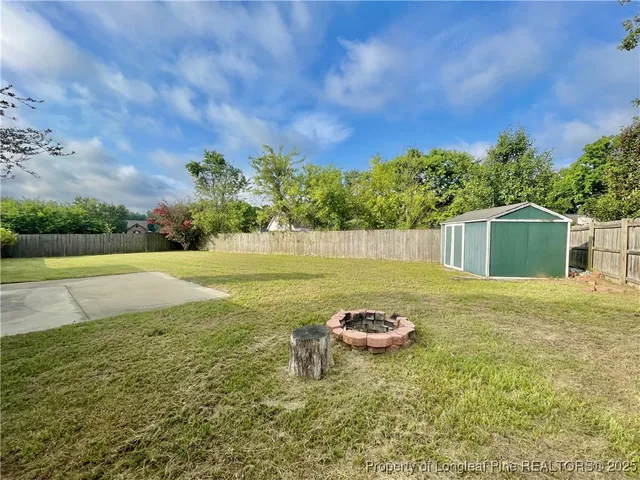 a view of a back yard of the house