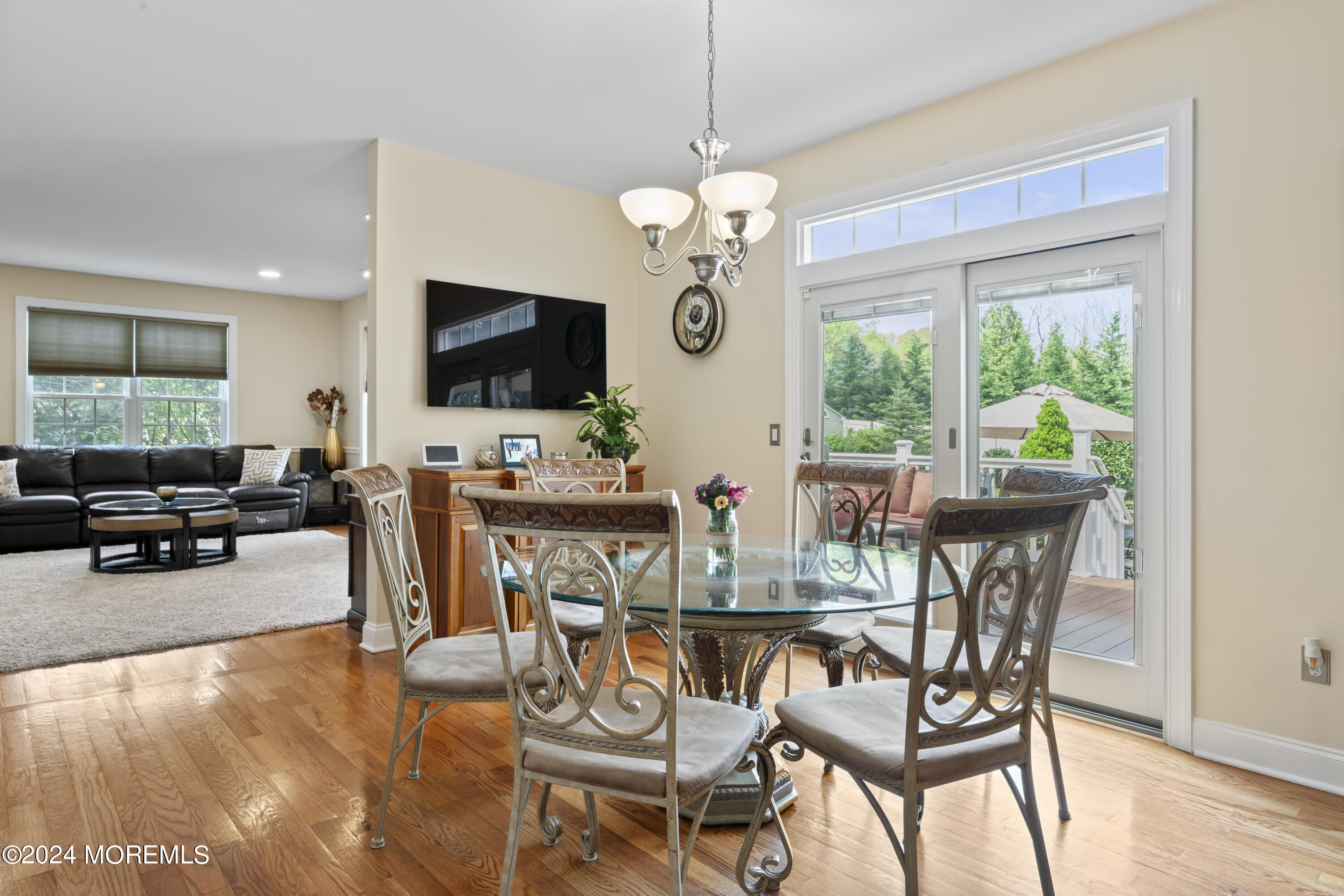 1588 West Front Street Lincroft, NJ 07738 - Photo 11 of 50 a view of a dining room with furniture a livingroom and chandelier