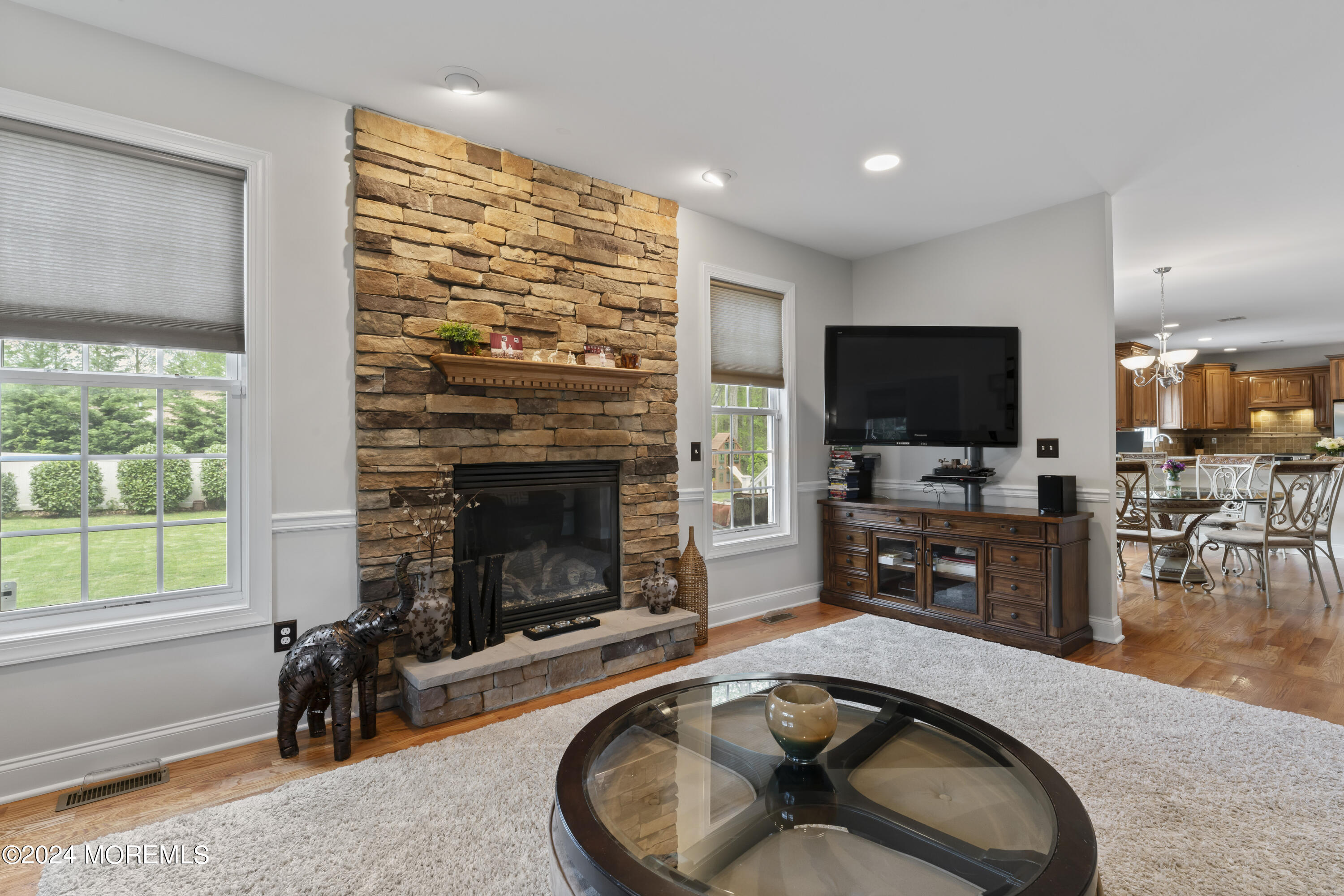 1588 West Front Street Lincroft, NJ 07738 - Photo 13 of 50 a living room with fireplace furniture and a flat screen tv