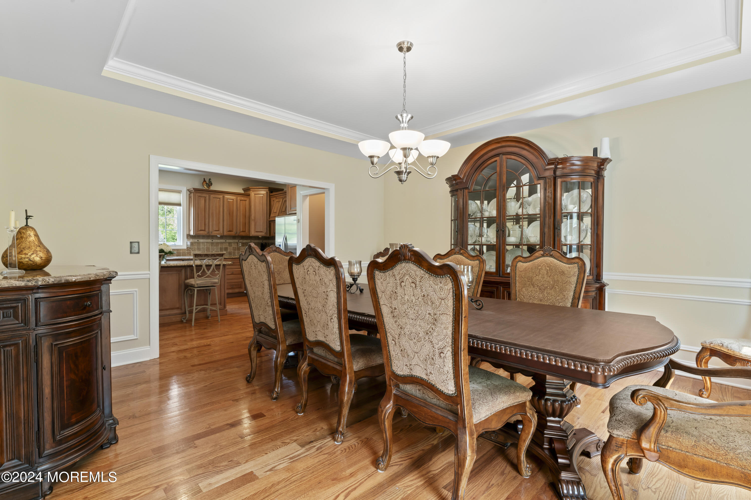 1588 West Front Street Lincroft, NJ 07738 - Photo 16 of 50 a view of a dining room with furniture and chandelier