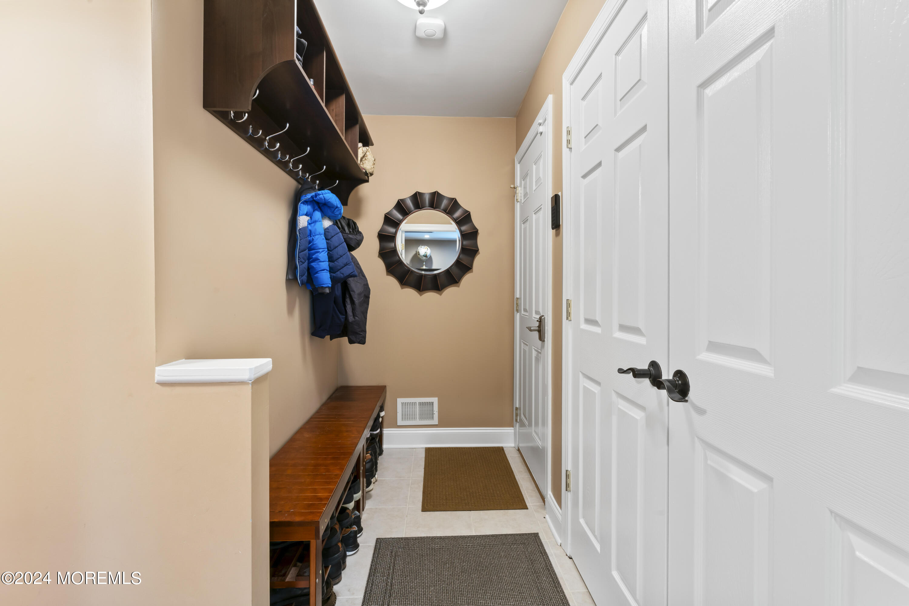 1588 West Front Street Lincroft, NJ 07738 - Photo 19 of 50 a view of a hallway with wooden floor