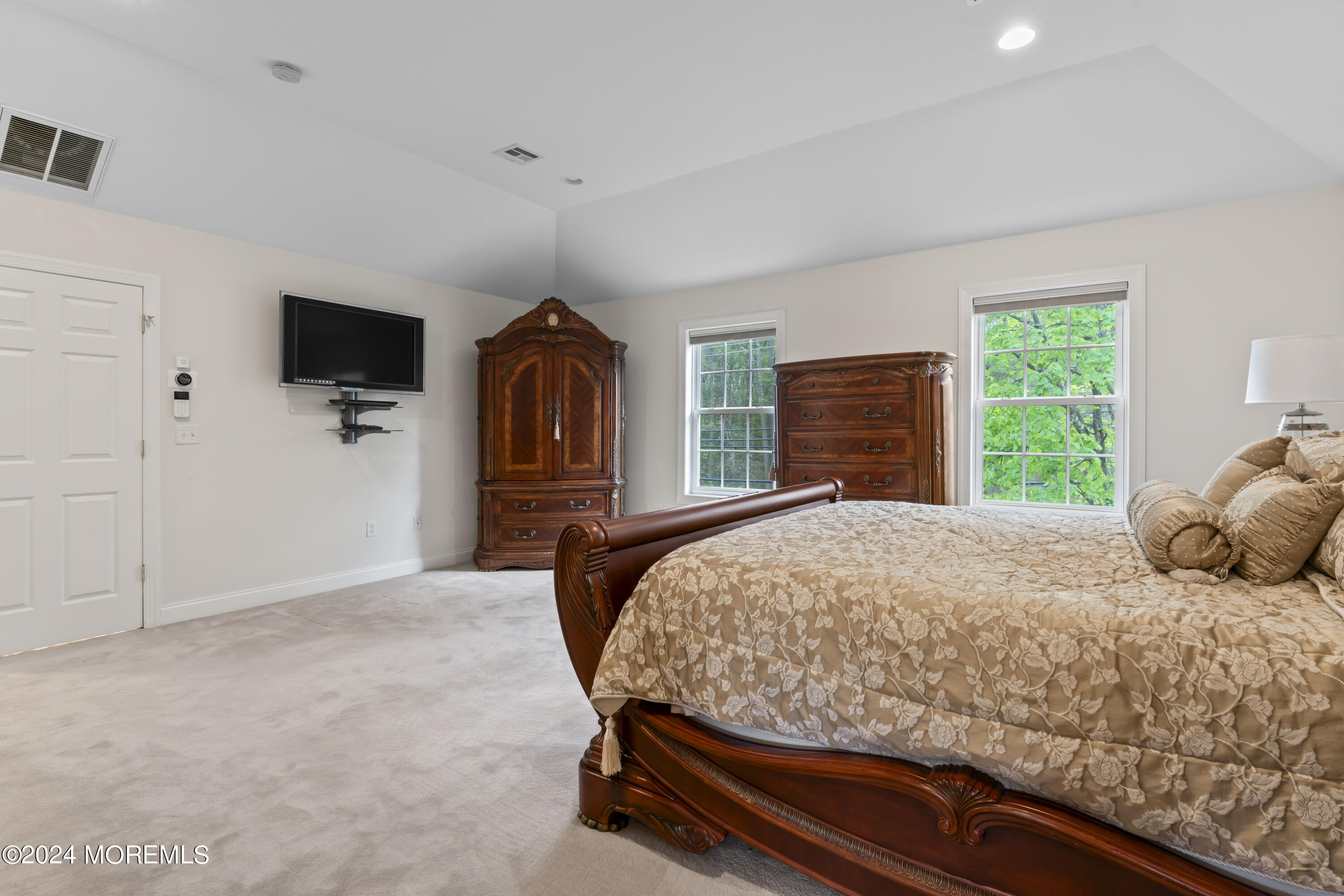 1588 West Front Street Lincroft, NJ 07738 - Photo 26 of 50 a bedroom with a bed and a television