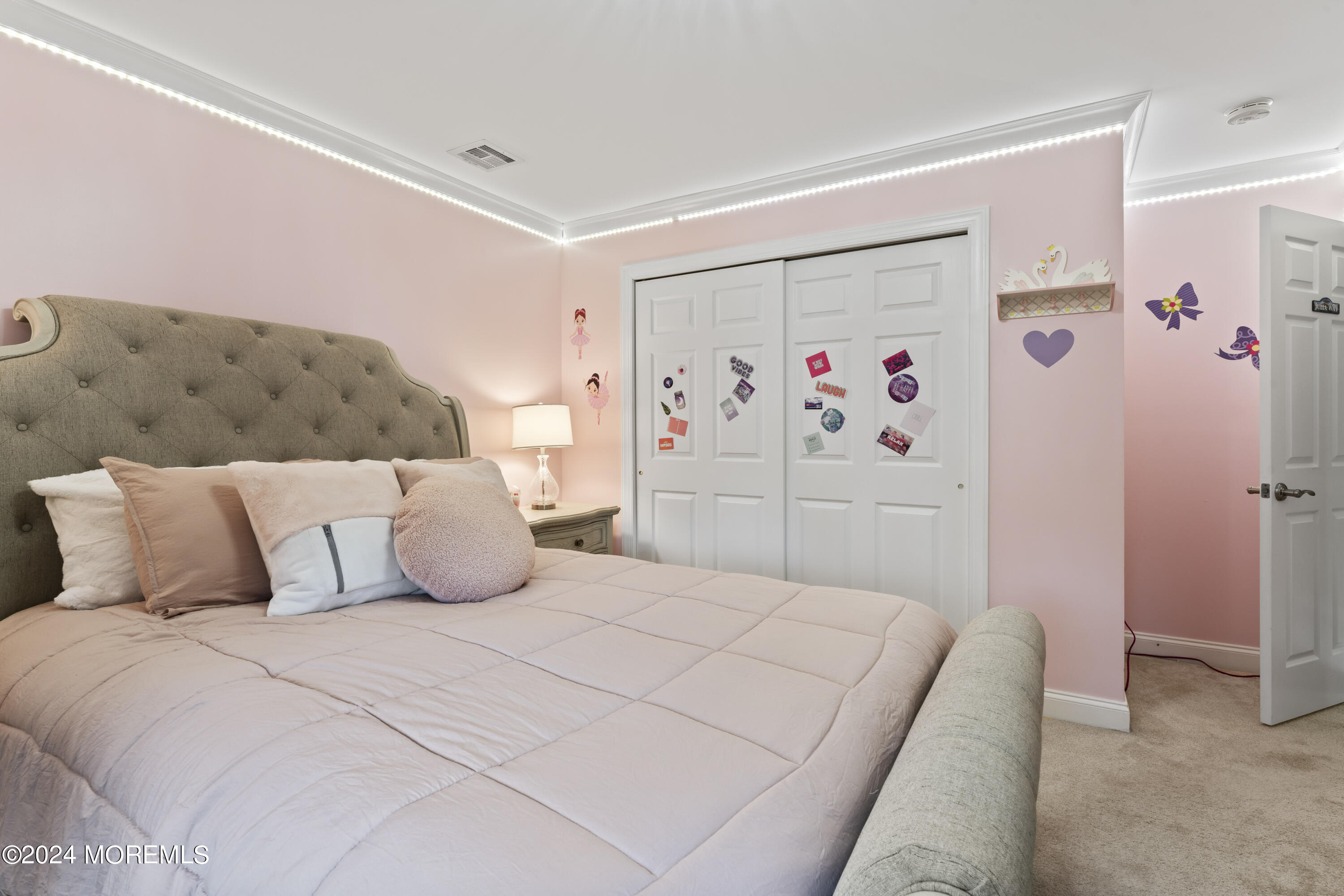 1588 West Front Street Lincroft, NJ 07738 - Photo 30 of 50 a bedroom with a large bed and a couch