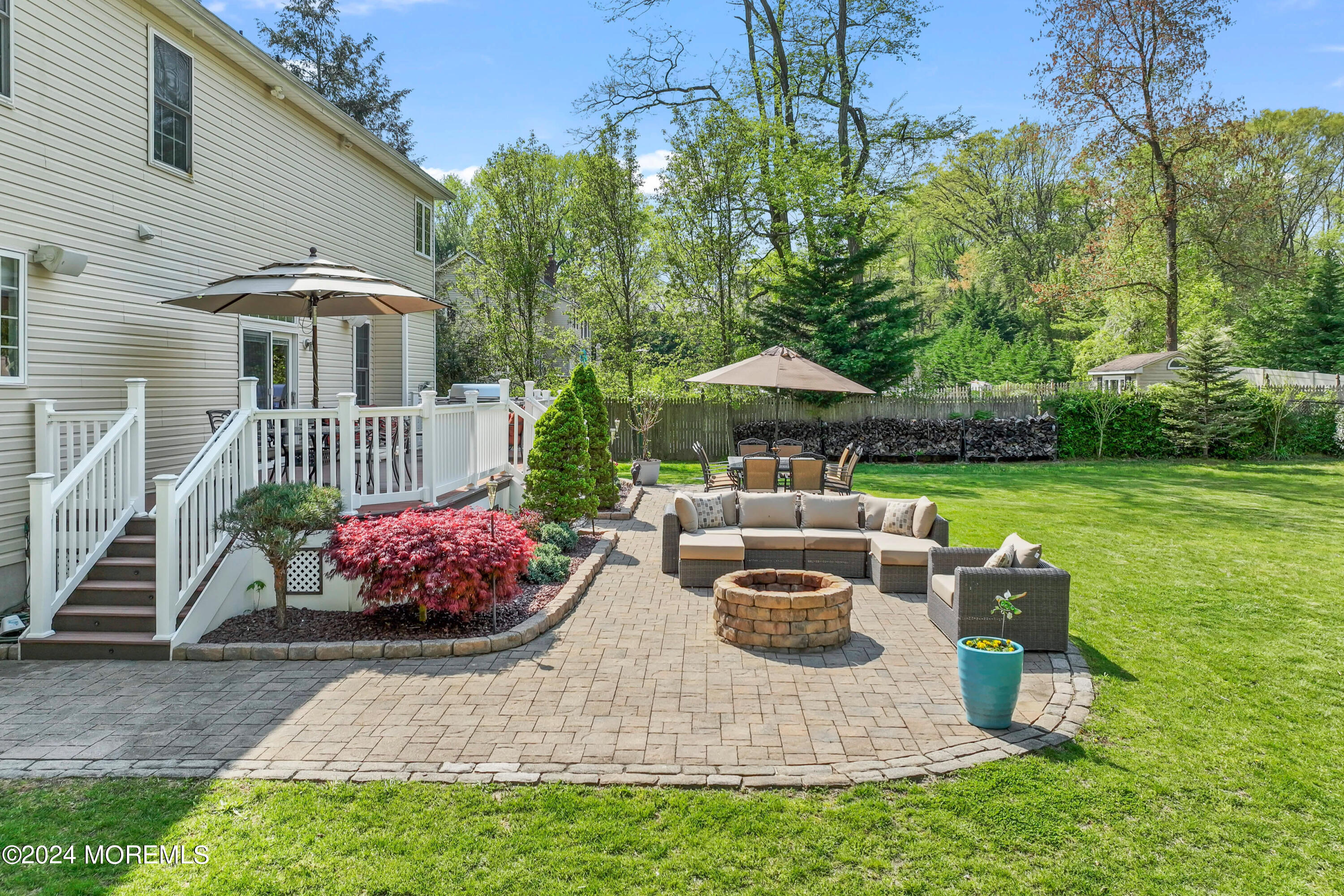 1588 West Front Street Lincroft, NJ 07738 - Photo 39 of 50 a view of a patio with furniture and a garden