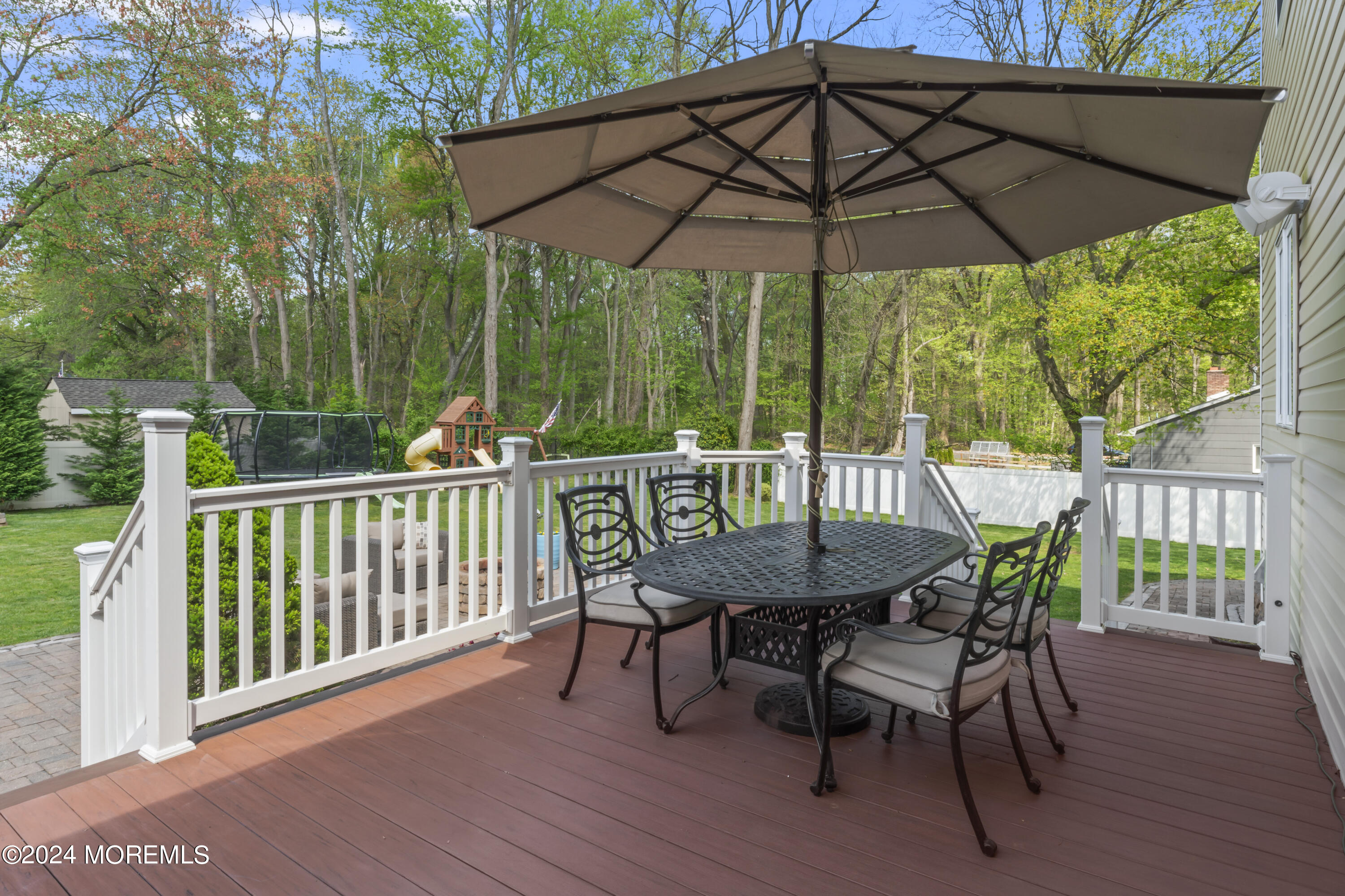 1588 West Front Street Lincroft, NJ 07738 - Photo 41 of 50 a view of a deck with furniture and a backyard