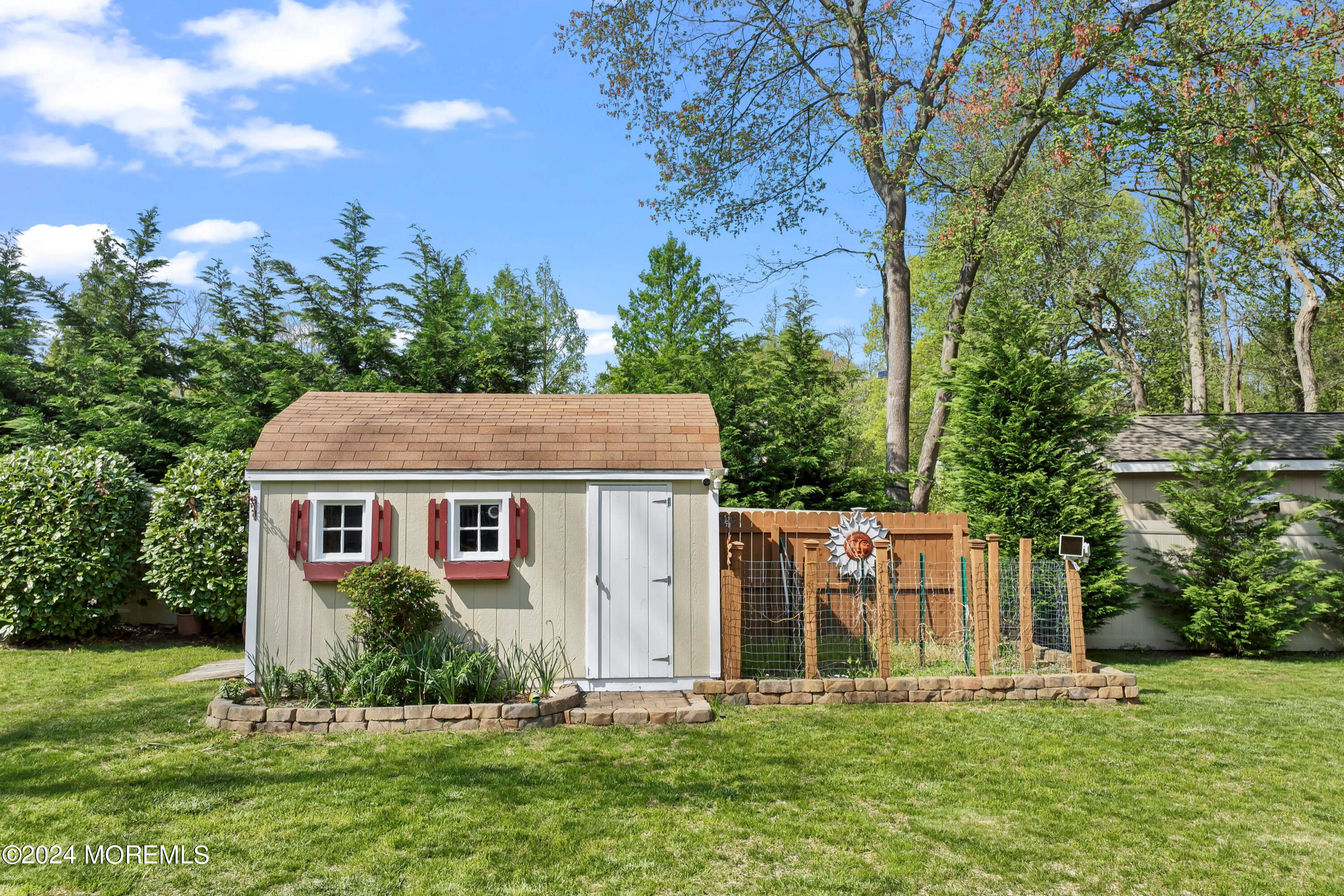 1588 West Front Street Lincroft, NJ 07738 - Photo 46 of 50 a front view of house with yard and trees