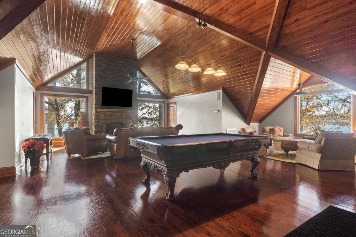 390 David Williams Road Sparta, GA 31087 - Photo 22 of 73 a living room with furniture a table and large windows