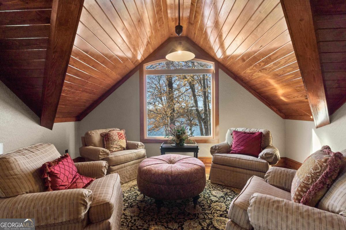 390 David Williams Road Sparta, GA 31087 - Photo 28 of 73 a living room with furniture and a large window