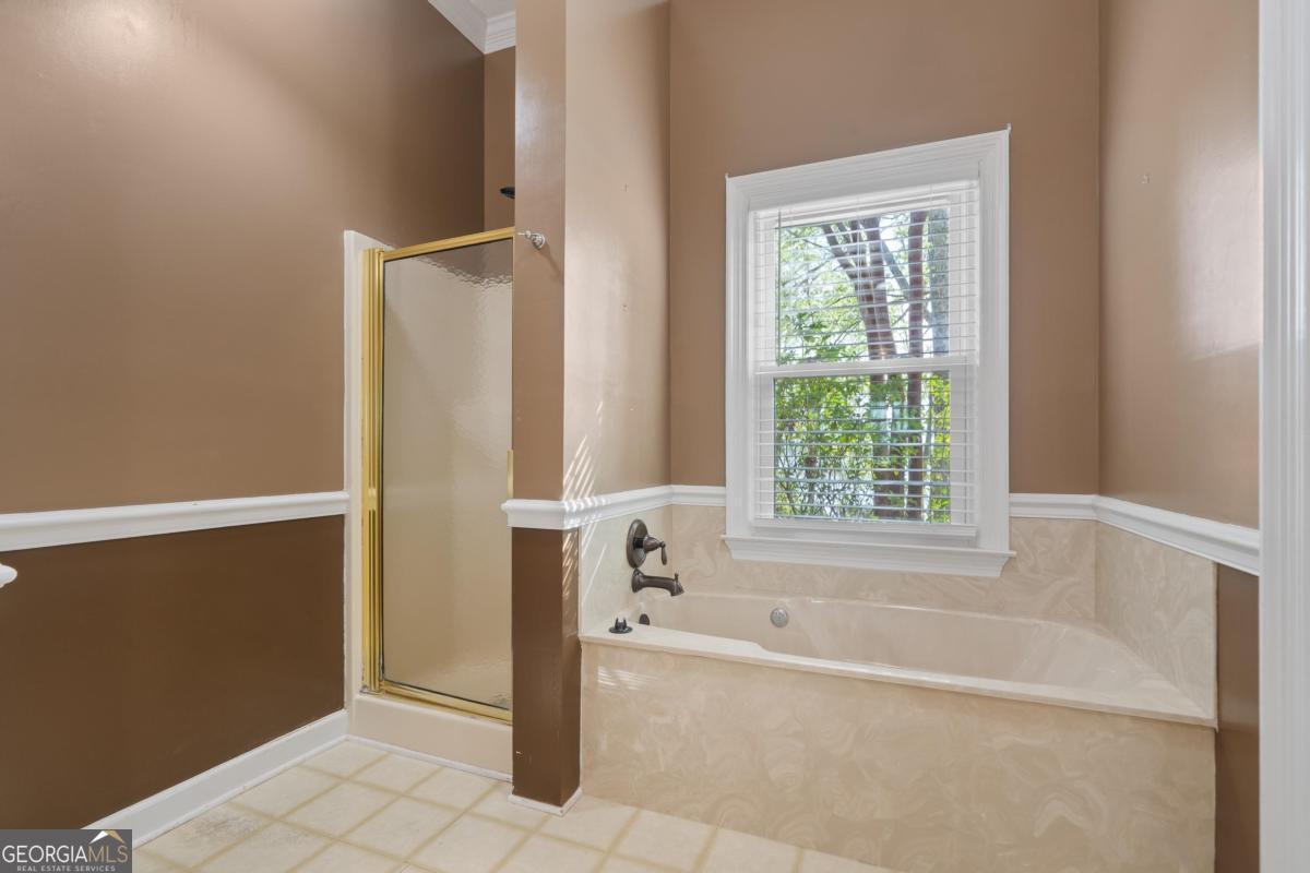 390 David Williams Road Sparta, GA 31087 - Photo 41 of 73 a bathroom with a bathtub and shower