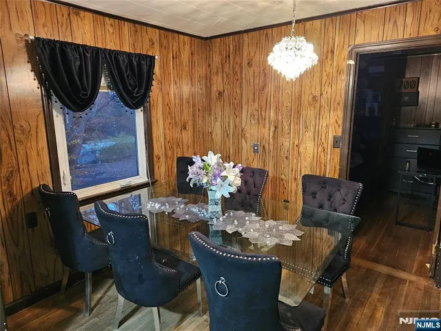 a dining room with furniture and chandelier