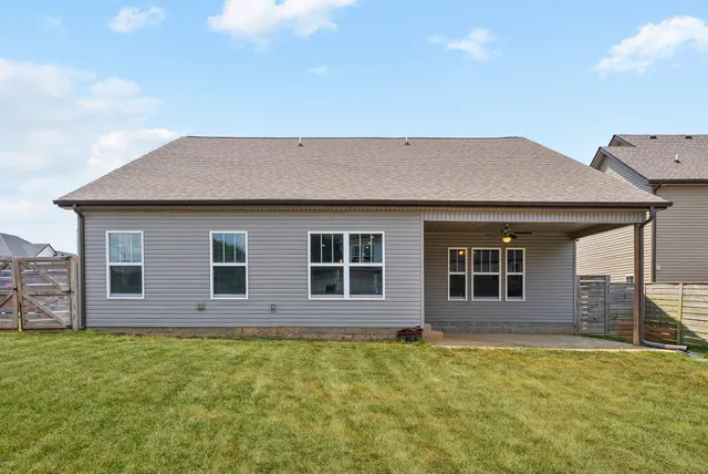 a backyard of a house with large trees